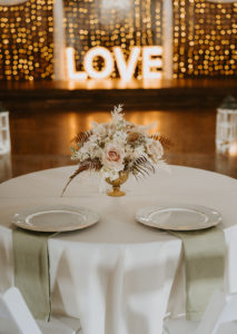 Houston Texas wedding venue reception with light up marquee sign, luxury linens, fresh flowers and table decor.