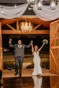 Bride & Groom grand entrance to their wedding venue reception near Houston