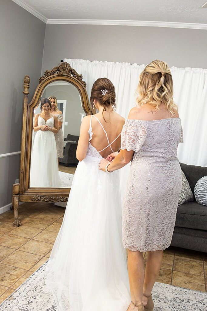 3 bride getting ready with mother