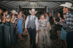 “Rustic barn reception setup with string lights and elegant décor at Pine Lake Ranch wedding venue.