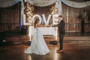 Romantic Road Trips for Texas Couples: Houston to Lake Conroe 8 Bride & Groom dancing at their wedding reception at an all inclusive affordable wedding venue near Houston