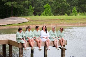 Houston bride and bridesmaids pose for wedding photos in matching pajamas