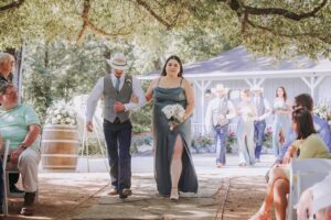 Wedding party walking down the aisle at an outdoor wedding ceremony near Houston