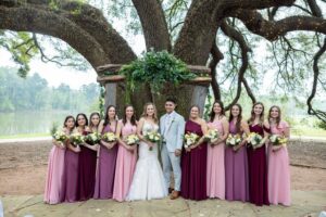 Pink and burgundy wedding color palette at an affordable wedding venue with western ranch style near Houston Texas