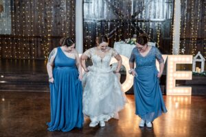 Blue color palette wedding with dark blue bridesmaid dresses