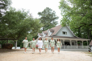 30 Meaningful Christian Wedding Traditions for Houston Couples 5 Bride and bridesmaids wearing matching wedding pajamas & robes as they post for wedding day photos near Houston